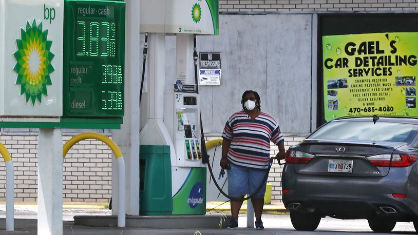 071322 Conyers: A motorist gases up her vehicle  with prices as low as 3.83 a gallon at the BP station on Salem Road on Wednesday, July 13, 2022, near Conyers.  “Curtis Compton / Curtis Compton@ajc.com”