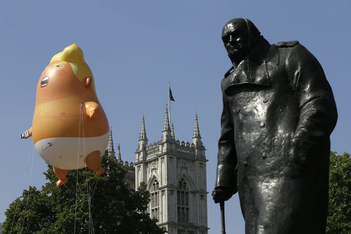 Photos: Baby Trump balloon flies over London protests