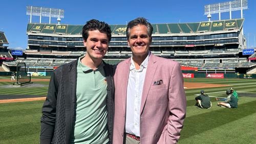 Oakland Athletics broadcaster Chris Caray, left, and his father, Chip, the play-by-play announcer for the St. Louis Cardinals, stand for a photo before the teams' baseball game Monday, April 15, 2024, in Oakland, Calif. (AP Photo/Janie McCauley)