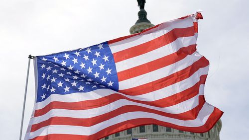 American flags wave in the wind outside the Capitol on Tuesday, April 23, 2024, in Washington. The Senate approved $95 billion in war aid to Ukraine, Israel and Taiwan. (AP Photo/Mariam Zuhaib)
