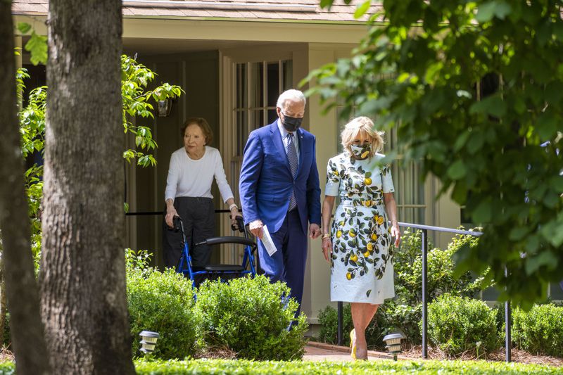 Rosalynn Carter stands on the front porch of her home as she watches President Joe Biden and first lady Jill Biden leave, after a visit with her husband, former President Jimmy Carter in Plains, Ga., Thursday, April, 29, 2021. (Doug Mills/The New York Times)