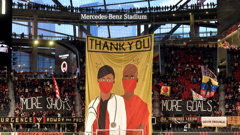 Atlanta United fans raise a giant “Thank you” banner before the game against Chicago Fire at Mercedes-Benz Stadium on Saturday, April 24, 2021. (Hyosub Shin / Hyosub.Shin@ajc.com)