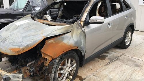 Danielle Reid says she and her husband, Kadarius Reid, struggled earlier this year with their 2014 Kia Sorento when was driving it on I-20 in Fulton County. Kadarius Reid pulled over to the side of the road and smoke began to billow from the engine compartment. Then there was an explosion and the vehicle was fully engulfed in flames, Danielle Reid said her husband said. Only a few months earlier a dealership had put in a replacement engine because of problems with the old one. (WSB-TV)