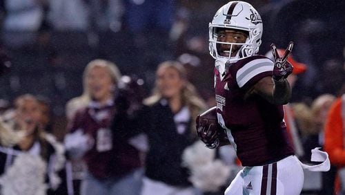 Rara Thomas of the Mississippi State Bulldogs gestures as he carries the ball during the second half against the Auburn Tigers at Davis Wade Stadium on Nov. 5, 2022, in Starkville, Miss. Thomas was arrested Monday on charges of false imprisonment and battery/family violence. (Justin Ford/Getty Images/TNS)