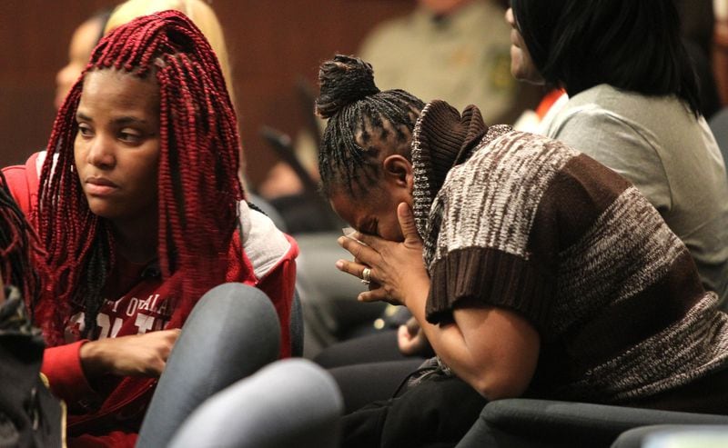 Melissa Alfred (right) weeps in the jury box while others comfort her at the Douglas County Courthouse on Monday. Alfred had been composed throughout the entire sentencing. But after defendant Kayla Norton addressed the victims, Alfred broke down and had to leave the room. (Henry Taylor / henry.taylor@ajc.com)