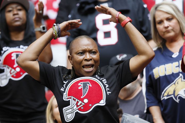 A Falcons fan reacts after the team scored a touchdown during the third quarter against the 49ers on Sunday at Mercedes-Benz Stadium. (Miguel Martinez / miguel.martinezjimenez@ajc.com)