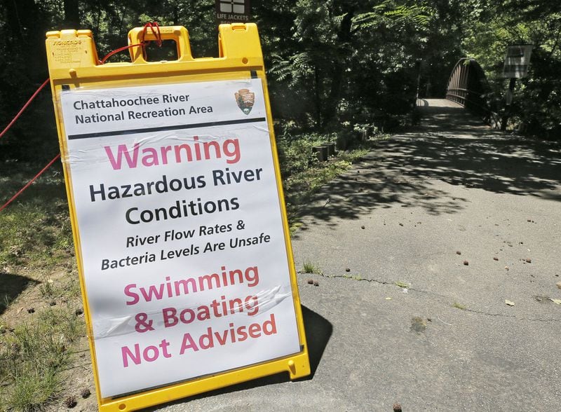 A sign at the Powers Island boat launch in Sandy Springs warns of river conditions.  BOB ANDRES / BANDRES@AJC.COM