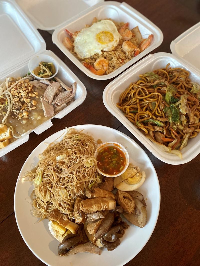 This takeout feast from Two Fish Myanmar includes (clockwise from left): meeshay, shrimp fried rice, stir-fry noodles with beef and grilled pork with noodles. Wendell Brock for The Atlanta Journal-Constitution