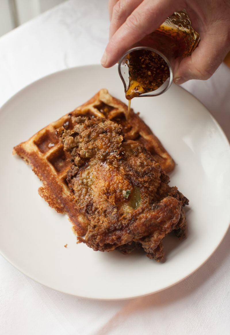  Asha Gomez's Keralan Fried Chicken, Lowcountry Cardamom Waffles and Spicy Maple Syrup.(Photography by Renee Brock/Special)