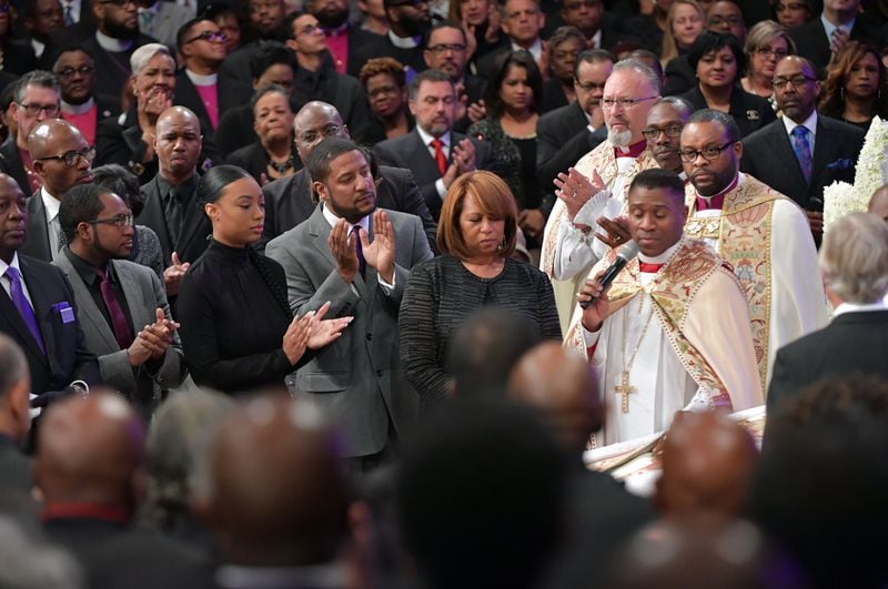JANUARY 25, 2017  LITHONIA Family members including wife, Vanessa (right center),  sons Edward, Jared and Eric and daughter Taylor, are shown during the Home-going services for Bishop Eddie Long, senior pastor, at New Birth Missionary Baptist Church, Wednesday, January 25, 2017. Bishop Long died January 15th, after a long-time fight with cancer. He was 63 years old.  Hyosub Shin/AJC