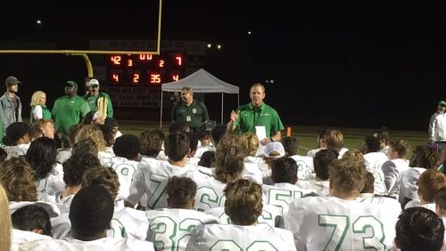 Buford coach John Ford talks to team after beating Flowery Branch for the region championship.