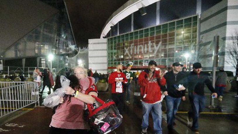 Atlanta Falcons fans leave the Georgia Dome happy after the victory over the Green Bay Packers in the NFC Championship game. BOB ANDRES / BANDRES@AJC.COM
