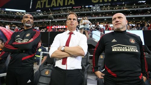 Atlanta United head coach Frank de Boer (center) and assistant coaches Orlando Trustfull (left) and Bob de Klerk lead the team in a 2-1 victory over New York City FC in their soccer match on Sunday, August 11, 2019, in Atlanta.   Curtis Compton/ccompton@ajc.com