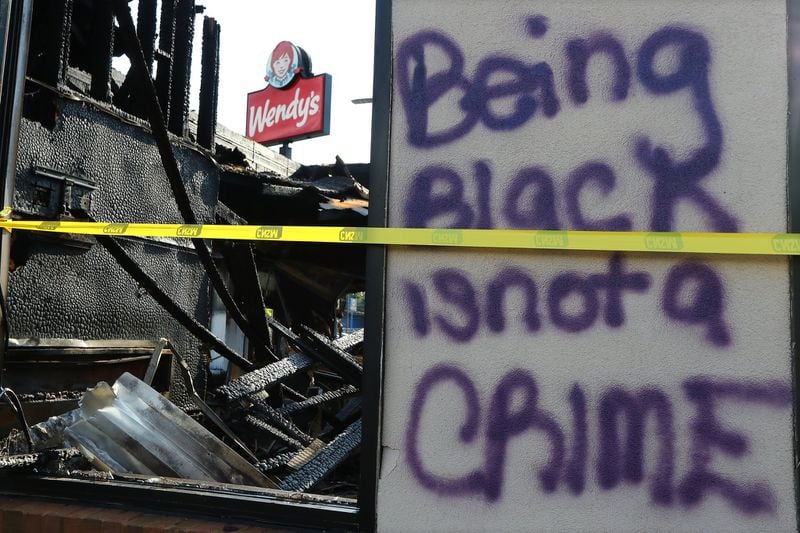 The charred ruins of the Wendy’s where Rayshard Brooks, a 27-year-old Black man, was shot and killed by Atlanta police on June 12, 2020, during a struggle in the drive-thru line. (Curtis Compton / ccompton@ajc.com)