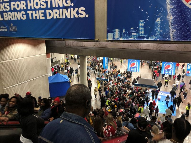 MARTA’s Dome station, adjacent to Mercedes-Benz Stadium, was packed at times Saturday and Sunday with passengers bound for Super Bowl festivities. (David Wickert/AJC)