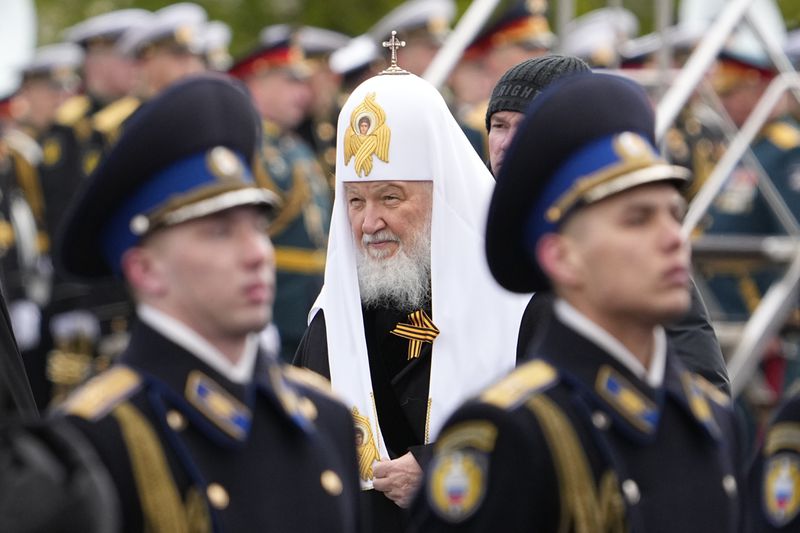Russian Orthodox Patriarch Kirill, center, arrives to attend the Victory Day military parade in Moscow, Russia, Thursday, May 9, 2024, marking the 79th anniversary of the end of World War II. (AP Photo/Alexander Zemlianichenko)