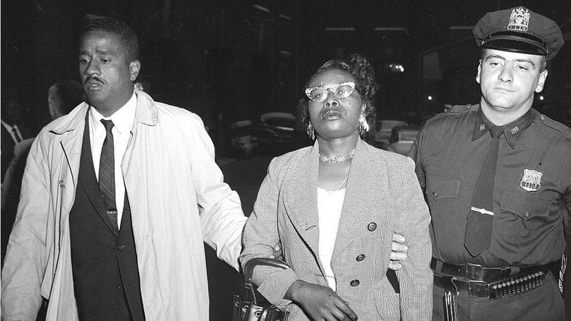 Izola Ware Curry, 42, is led away by police following her arrest Sept. 20, 1958, for stabbing the Rev. Dr. Martin Luther King Jr. in the chest during a book signing in Harlem. Curry, who was diagnosed with paranoid schizophrenia, was found unfit to stand trial and spent the rest of her life institutionalized.