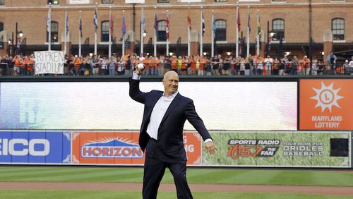 Former Baltimore Oriole Cal Ripken, Jr., throws out the ceremonial first pitch to mark the twentieth anniversary of his streak of 2,131 straight games before a baseball game between the Orioles and the Tampa Bay Rays, Tuesday, Sept. 1, 2015, in Baltimore. (AP Photo/Patrick Semansky)