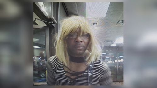 Police are searching for a man who they say robbed DeKalb business while wearing long wigs.