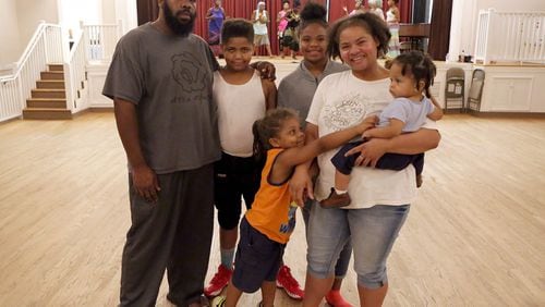 Christan Theresa Poret and her family, (from left), husband Mark Poret, son Sean, 10, son Cameren (cq) 4, daughter Meah (cq) 13, and son Jaydn (cq) 15-months, at the Clarkston Community Center on Thursday, August 24, 2017. Poret relocated to Atlanta from New Orleans during hurricane Katrina. (Akili-Casundria Ramsess/Special to the AJC)
