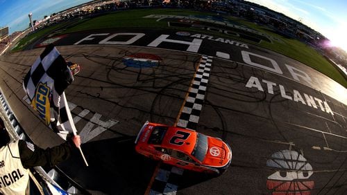 Brad Keselowski, driver of the #2 Autotrader Ford, crosses the finish line to win last year's Folds of Honor QuikTrip 500 at Atlanta Motor Speedway.  (Photo by Sean Gardner/Getty Images)