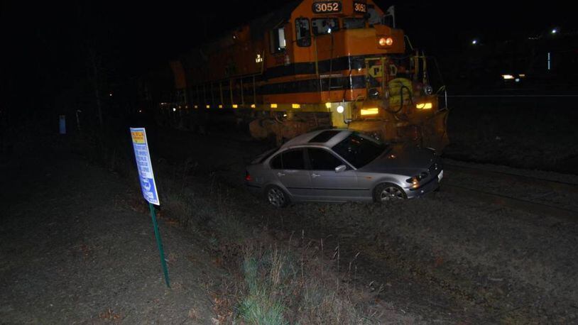 A train that became stuck on railroad tracks was pushed 15 feet after it was hit by a train Friday morning.