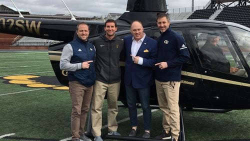 Georgia Tech coach Geoff Collins (second from right, in blazer) with (from left) tight ends coach Chris Wiesehan, Carrollton High coach Sean Calhoun and safeties coach Nathan Burton. The Tech coaches visited the school by helicopter January 22, 2019 (Courtesy Sean Calhoun)