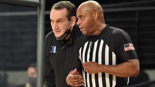 Duke head coach Mike Krzyzewski confers with a referee during overtime loss to Georgia Tech Tuesday, March 2, 2021, at McCamish Pavilion in Atlanta. (Hyosub Shin / Hyosub.Shin@ajc.com)