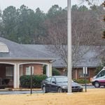 An ambulance delivers a patient to the Rosemont at Stone Mountain senior living facility on Thursday. On one day in January, Rosemont reported 21 COVID-19 deaths to the state’s daily public case-tracker. (Jenni Girtman for The Atlanta Journal-Constitution)