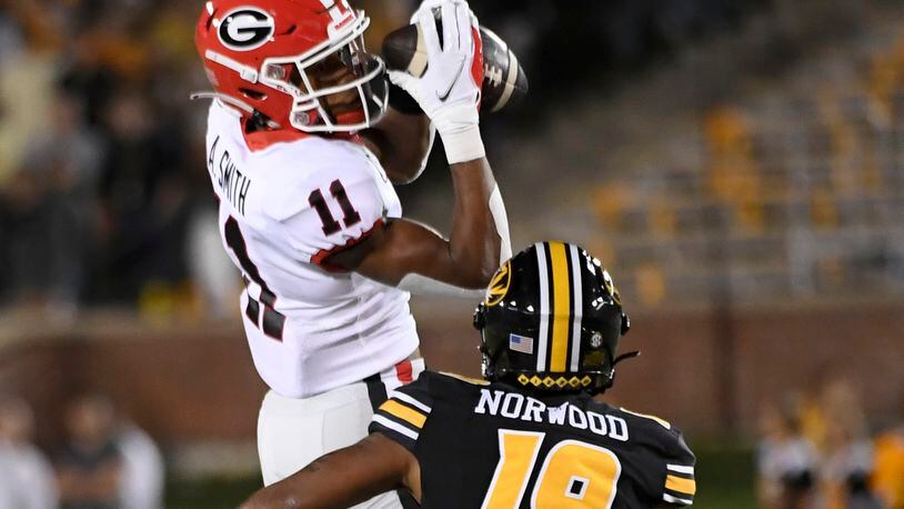 Georgia wide receiver Arian Smith (11) catches a pass as Missouri defensive back Dreyden Norwood (19) defends during the first half of an NCAA college football game Saturday, Oct. 1, 2022, in Columbia, Mo. (AP Photo/L.G. Patterson)