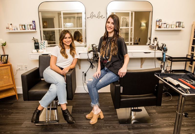 At LM Studio in Alpharetta, Megan Pigott, left, and Laura Silverstein, right, offer suggestions for men include getting good mirror views and making small adjustments, using a comb and clippers and getting help if possible. Photo: Jenni Girtman/Atlanta Journal-Constitution)