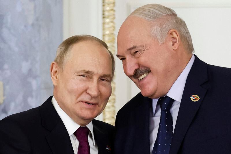 FILE Russian President Vladimir Putin, left, and Belarus President Alexander Lukashenko shake hands during a meeting of the Union State Supreme Council in St. Petersburg, Russia, Monday, Jan. 29, 2024. Last year, Russia moved some of its tactical nuclear weapons into the territory of its ally Belarus that neighbors Ukraine and NATO members Poland, Latvia and Lithuania. (Dmitry Astakhov, Sputnik, Government Pool Photo via AP, File)