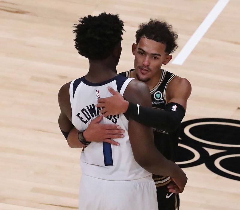 Hawks guard Tray Young hugs Timberwolves guard Anthony Edwards after the 108-97 win in the MLK Day Unity game Monday, Jan. 18, 2021, at State Farm Arena in Atlanta. (Curtis Compton / Curtis.Compton@ajc.com)