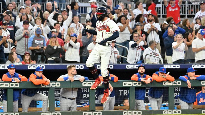 Braves shortstop Dansby Swanson (7) celebrates after hitting a solo home run in the first inning at Truist Park on Sunday, October 2, 2022. (Hyosub Shin / Hyosub.Shin@ajc.com)