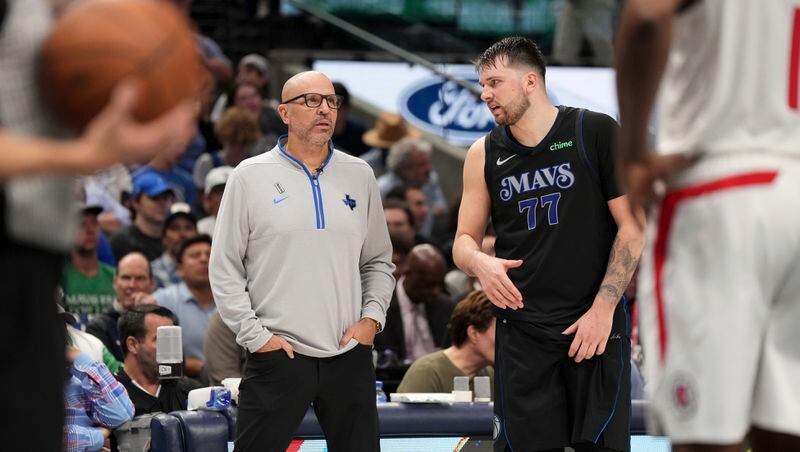 Dallas Mavericks guard Luka Doncic (77) talks to head coach Jason Kidd during the fourth quarter of an NBA basketball first-round playoff series against the Los Angeles Clippers Friday, May 3, 2024, in Dallas. (AP Photo/Jeffrey McWhorter)