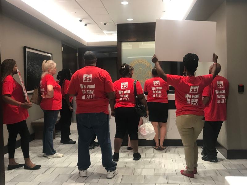 Union members at Atlanta Mayor Kasim Reed's office, handing over a petition asking for worker retention measures in airport concessions.