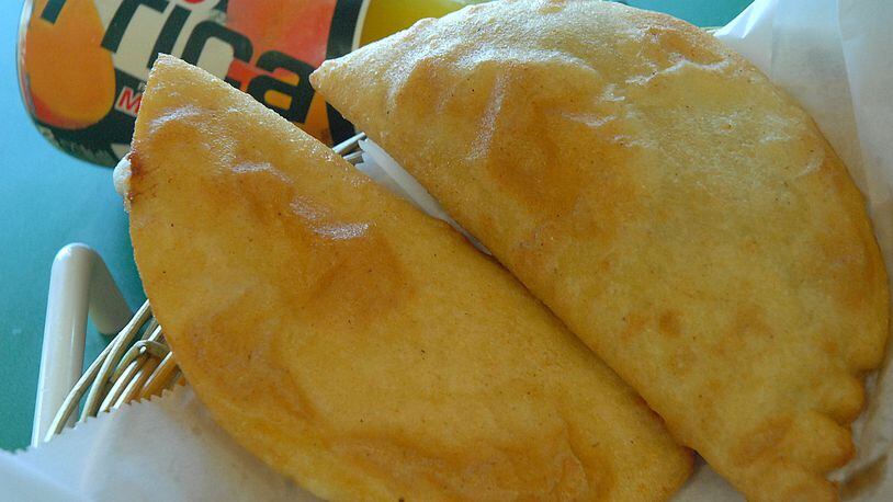 When dining at the Natarica Grill Venezuelan restaurant in Norcross, it’s always a good idea to order some cheese-filled empanadas. AJC FILE