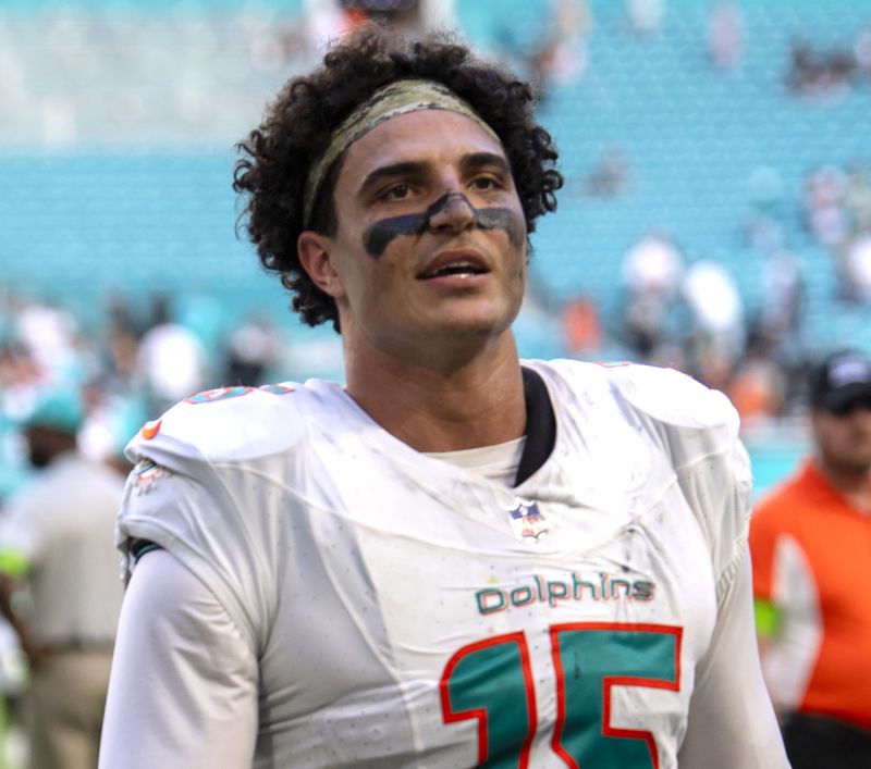 FILE - Miami Dolphins linebacker Jaelan Phillips walks off of the field after playing the Las Vegas Raiders, Nov. 19, 2023, in Miami Gardens, Fla. The Dolphins exercised the fifth-year options for Phillips and wide receiver Jaylen Waddle, the team announced Monday, April 29, 2024. (AP Photo/Michael Laughlin)