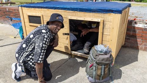 Brandon Brando with Reginald Driskell, a homeless man living in southwest Atlanta who he befriended and constructed a 7 by 3 foot wooden structure for the man with circulating air to get him out of an old cardboard box he's been living in. He'd like to do that for others as well. 
 PHIL SKINNER FOR THE ATLANTA JOURNAL-CONSTITUTION.