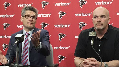 Atlanta Falcons General manager Thomas Dimitroff, left, and Head Coach Dan Quinn speak at a news conference Thursday, Jan 28, 2016, in Flowery Branch, Ga., to discuss the direction of the team after an 8-8 season. (AP Photo/Paul Newberry)
