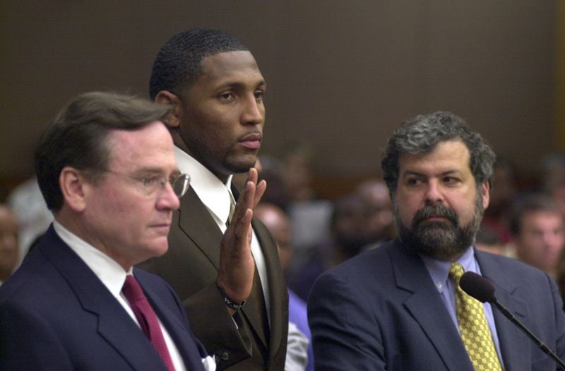 NFL star Ray Lewis (center) in 2000 made a mid-trial guilty plea to a misdemeanor charge of obstruction of justice after striking a plea bargain with prosecutors. He stands between his two attorneys — Ed Garland (left) and Don Samuel.