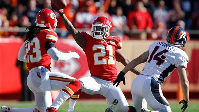 Kansas City Chiefs cornerback Javier Arenas (21) comes up with the ball after intercepting a pass intended for Denver Broncos wide receiver Brandon Stokley (14) during the first half of an NFL football game at Arrowhead Stadium in Kansas City, Mo., Sunday, Nov. 25, 2012. Chiefs free safety Kendrick Lewis (23) was in on the play. (AP Photo/Ed Zurga) Kansas City Chiefs cornerback Javier Arenas (21) comes up with the ball after intercepting a pass intended for Denver Broncos wide receiver Brandon Stokley (14) during the first half of an NFL football game at Arrowhead Stadium in Kansas City, Mo., Sunday, Nov. 25, 2012. Chiefs free safety Kendrick Lewis (23) was in on the play. (AP Photo/Ed Zurga)