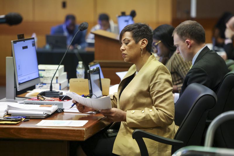 Fulton County Chief Deputy District Attorney Adriane Love looks over a document during the Atlanta Rapper Young Thug trial at the courtroom of Judge Ural Glanville at the Fulton County Courthouse, Friday, March 22, 2024, in Atlanta. (Jason Getz / jason.getz@ajc.com)