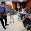 John Abel leads a music therapy class at A.G. Rhodes, a Wesley Woods a senior care facility, as residents Barbara Walker, Virginia Beaty and Shelia Lindsey dance and play instruments on Tuesday, January 10, 2023. Miguel Martinez / miguel.martinezjimenez@ajc.com