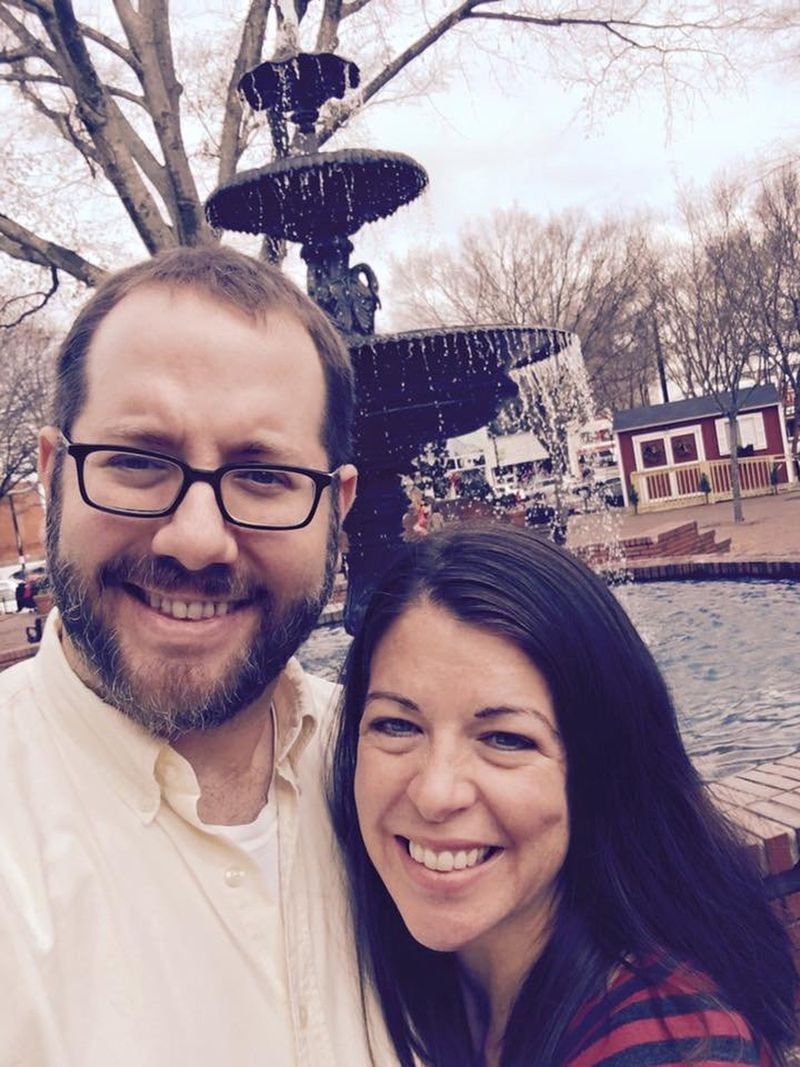 Matt Courtoy and his wife Kathryn on the Marietta Square in Cobb County. (AJC staff photo)