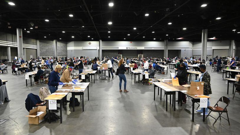Fulton County members of a recount team work on hand recount and audit of ballots at the Georgia World Congress Center on Nov. 14, 2020. (Hyosub Shin / Hyosub.Shin@ajc.com)