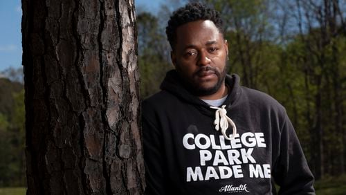 Mose James IV, who grew up in the Sunrise community in College Park, is fighting against a battery storage facility that is planned for the land behind him where he played as a kid. Photographed on Thursday, April 4, 2024.   (Ben Gray / Ben@BenGray.com)