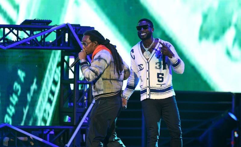 Takeoff of Migos (front) and Gucci Mane perform onstage during the Bud Light Super Bowl Music Fest / EA SPORTS BOWL. Takeoff was accused of rape.