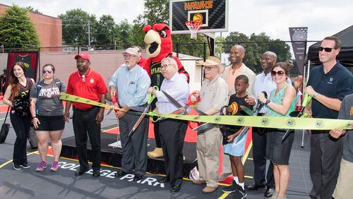 Hall of Famer Dominique Wilkins, College Park city leaders and over 300 youth attended the Atlanta Hawks Foundation dedication of two new basketball courts at Badgett Stadium in College Park on Friday, June 15. CONTRIBUTED