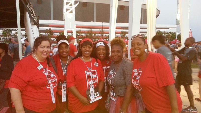 Demetria Gholston (middle, red headband) and other participants in 2016’s Walk Like MADD, which finished at the Georgia Dome. This was the first time MADD Georgia and the Atlanta Falcons combined their walk/5K run events, and some of the other women in the photo were Falcons fans who volunteered to carry photos of Gholston’s son, Josh D. Keith, a drunken driving victim, during the event. CONTRIBUTED BY MADD GEORGIA